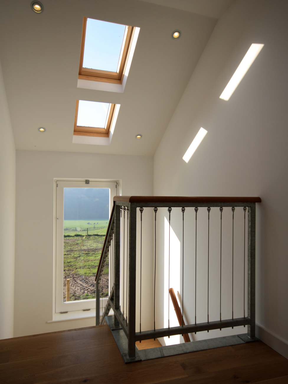 This landing benefits from additional natural light through two roof windows, while the picture-window draws your attention to the countryside view.